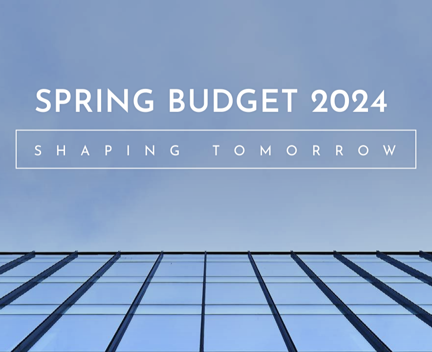 spring budget 2024 image of blue sky reflected in office building